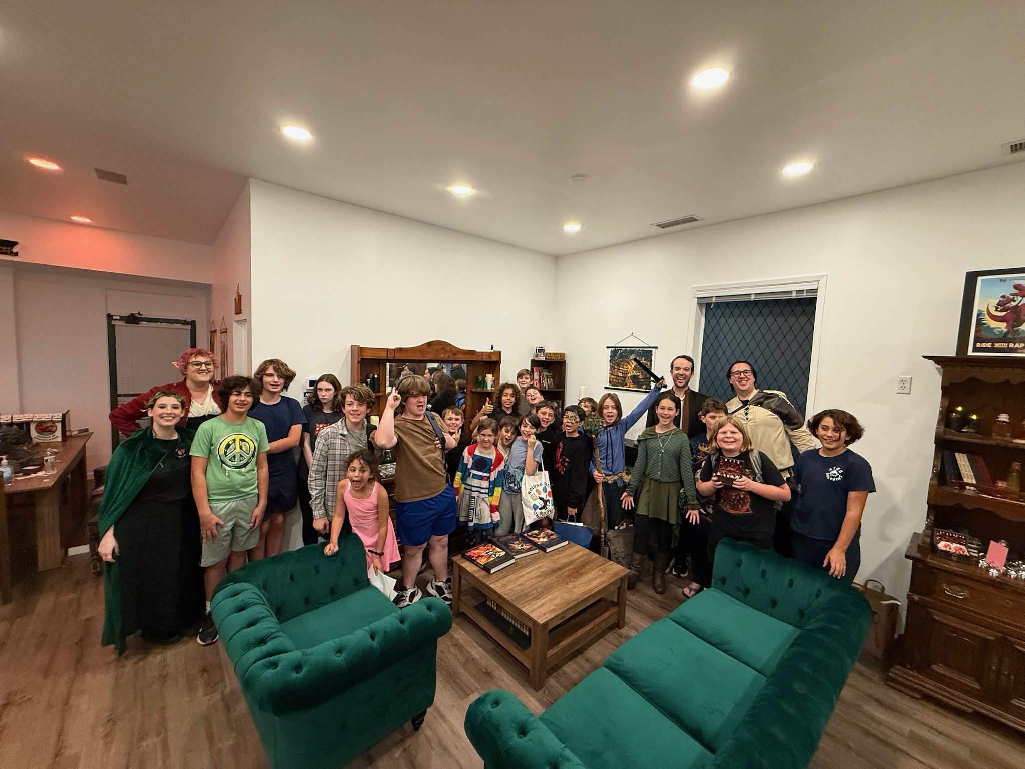 A Dungeon Master pretends to swing a sword for a group of players during a game of Dungeons & Dragons.